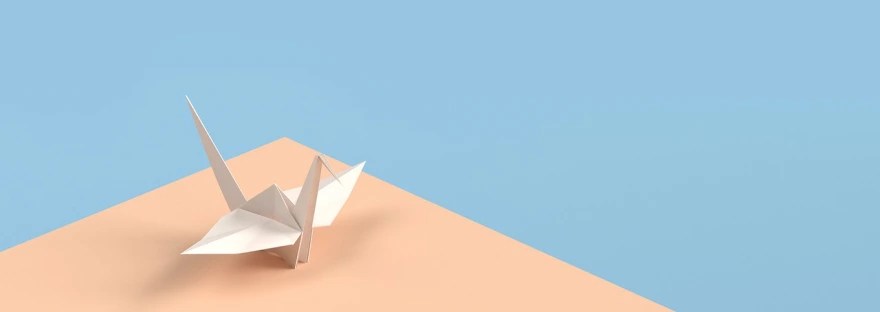 origami crane blue orange background